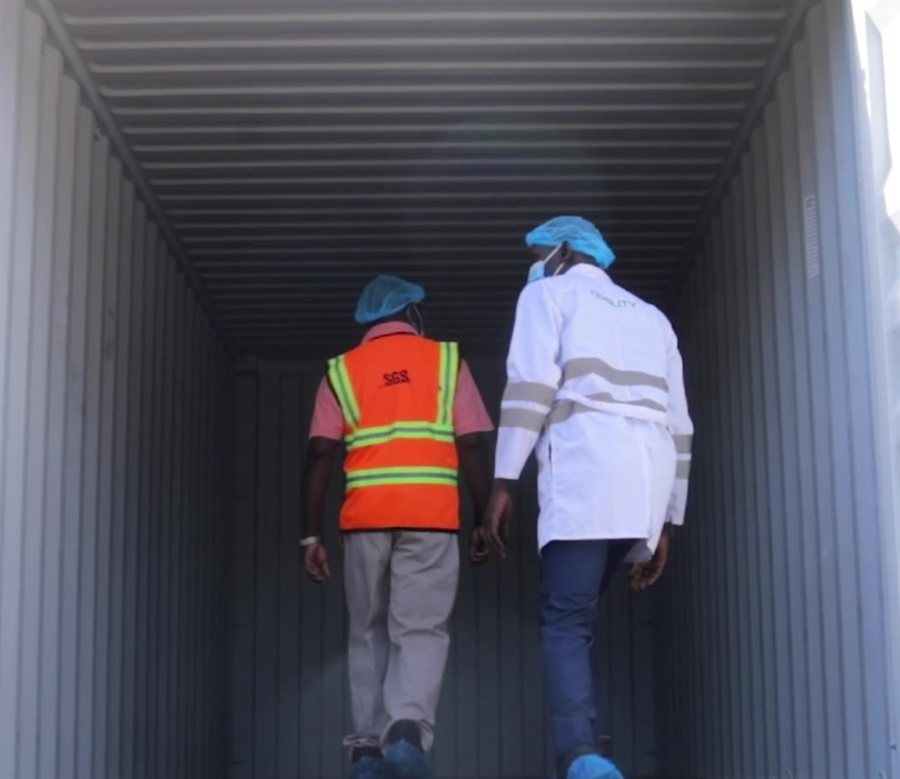 Quality and independent inspectors checking an empty container before loading